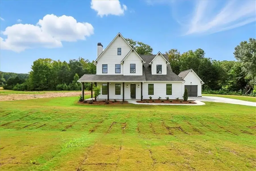 Front exterior of a new home in Old Town Estates, Monroe, GA, highlighting curb appeal (Image 32).