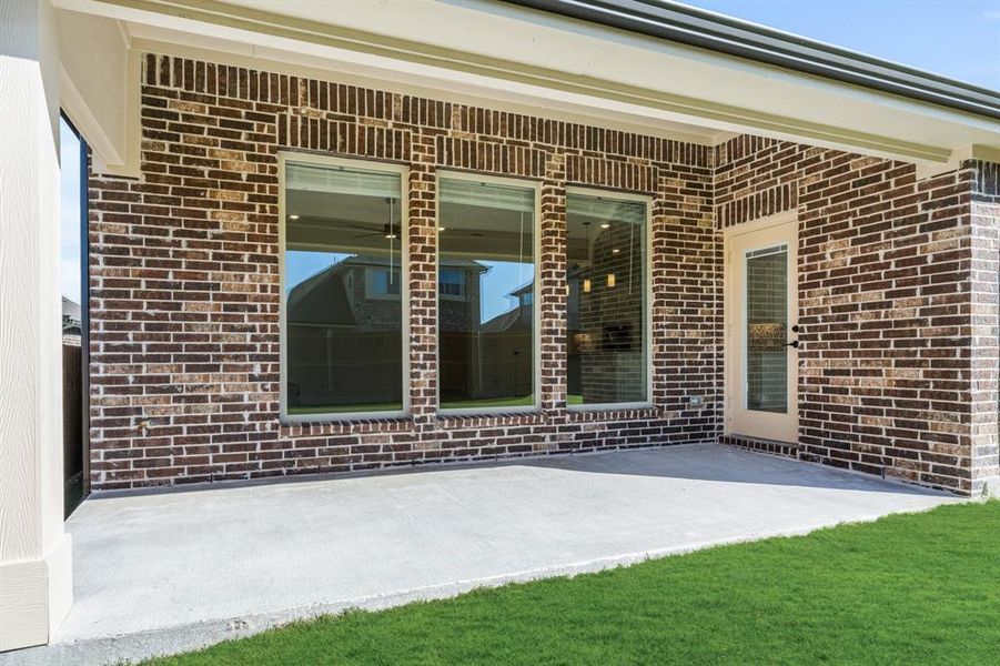 Exterior details and patio area of a home in Meadow Vista 60-65, Anna (Image 4). Exterior details and patio area of a home in Meadow Vista 60-65, Anna (Image 4).