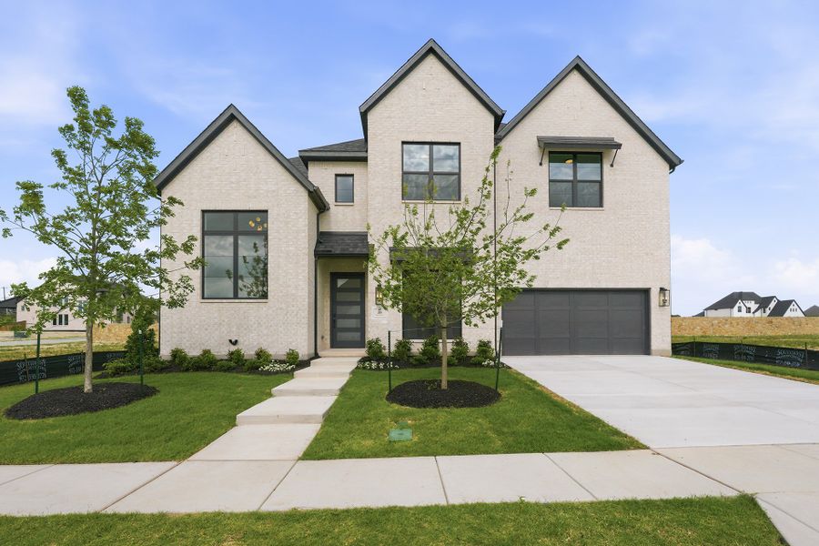 Front exterior of a new home in Custer Ridge Estates, Allen, TX, highlighting curb appeal (Image 27). Front exterior of a new home in Custer Ridge Estates, Allen, TX, highlighting curb appeal (Image 27).