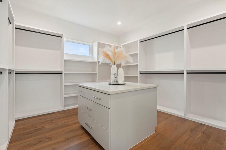 Oversized closet with island and built in dresser