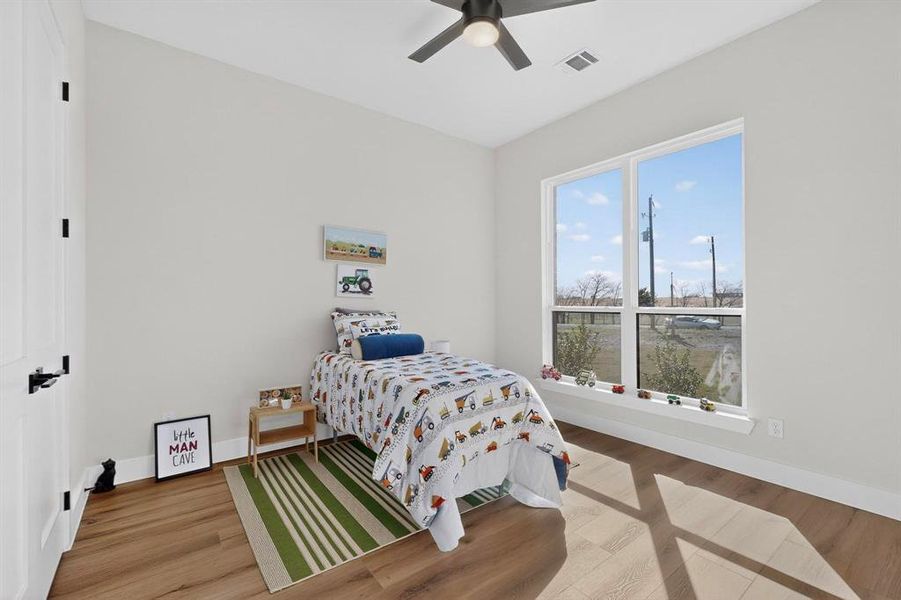 Bedroom featuring light wood-style flooring and ceiling fan