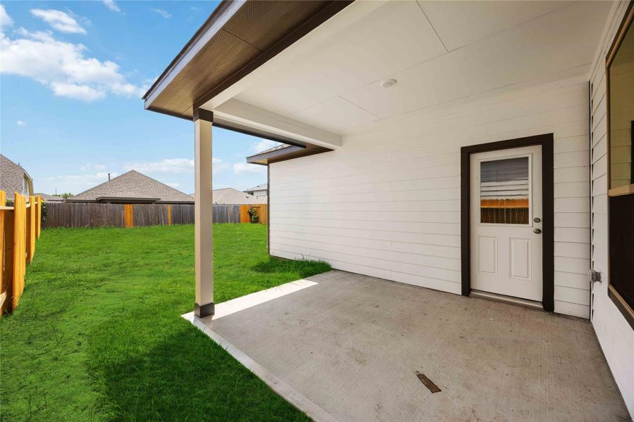 Exterior details and patio area of a home in Bluebonnet Village, Bellville (Image 16).