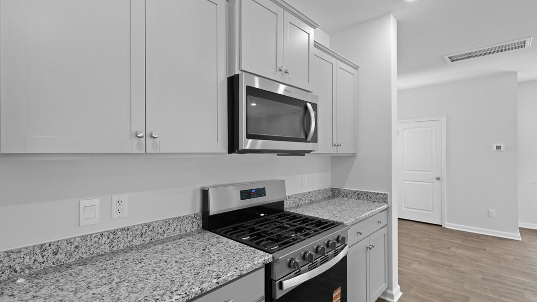 Representative furnished interior of a home built from the Aisle by D.R. Horton in Pine Hills at Cane Bay, Summerville (Image 8).