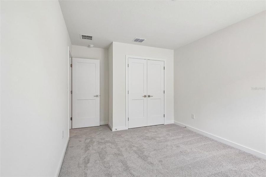 Spacious, unfurnished interior of a new home in Grasslands West, Lakeland (Image 26).