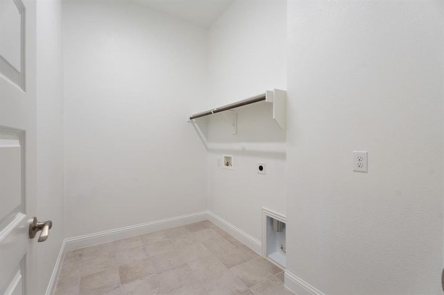 Laundry room with washer hookup and hookup for an electric dryer