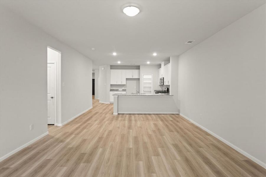 Unfurnished living room featuring light hardwood / wood-style floors