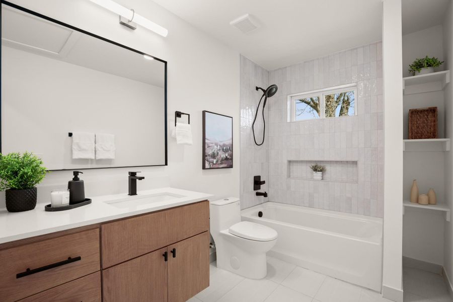 Full bathroom with vanity, tub / shower combination, and light tile patterned floors