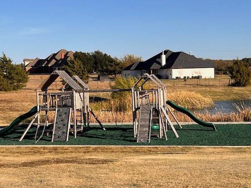 Community playground with a yard