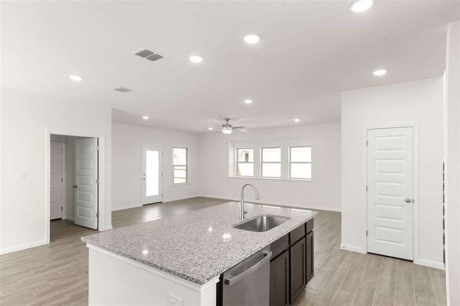 Kitchen with visible vents, dishwasher, recessed lighting, a ceiling fan, and a sink