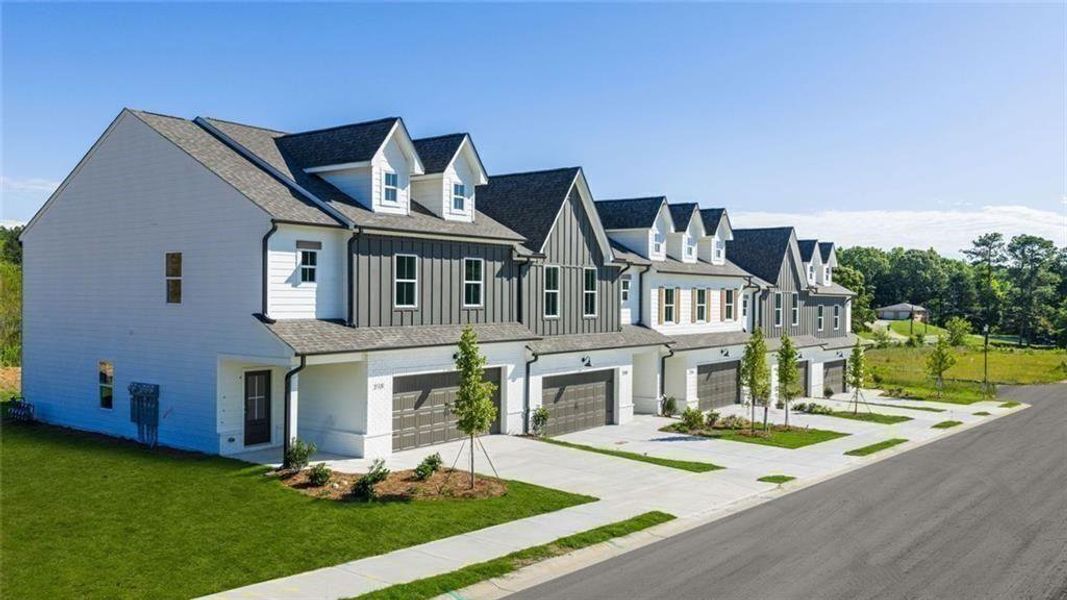 Front exterior of a new home in , Loganville, GA, highlighting curb appeal (Image 25).