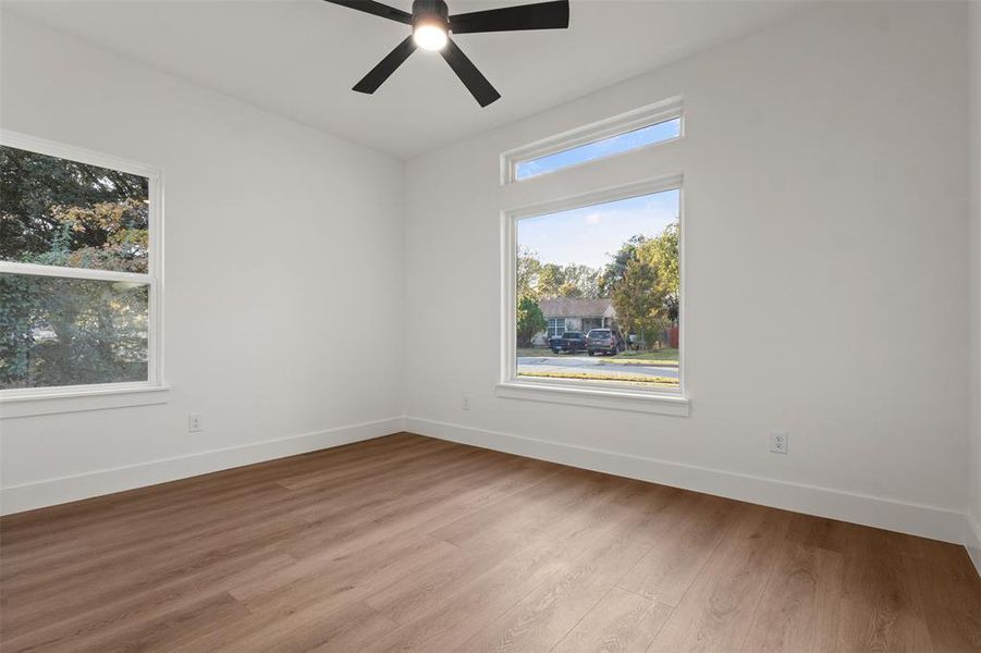Spare room featuring wood finished floors and ceiling fan