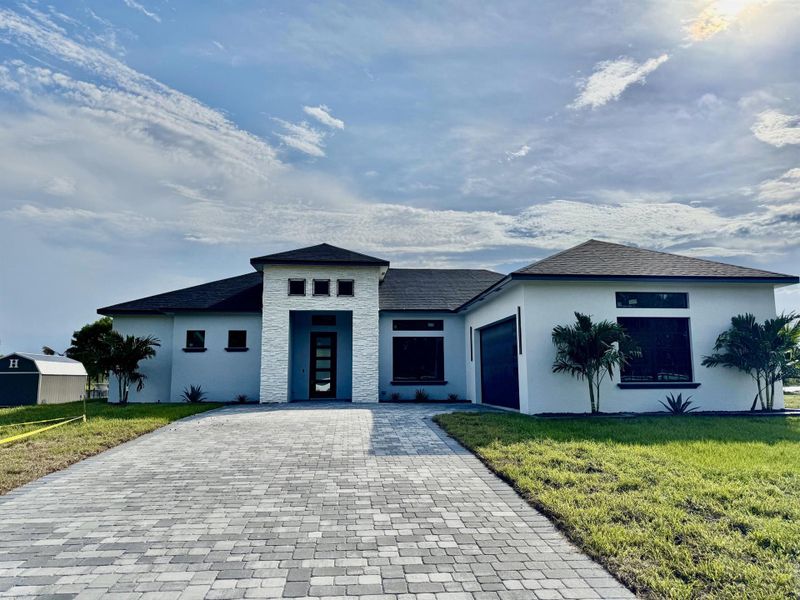 Front exterior of a new home in , Okeechobee, FL, highlighting curb appeal (Image 2).