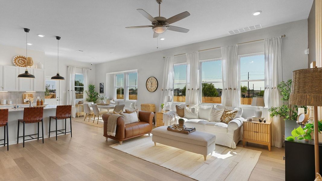 An open floorplan seamlessly connects the kitchen and living areas, offering effortless daily living. An open floorplan seamlessly connects the kitchen and living areas, offering effortless daily living.