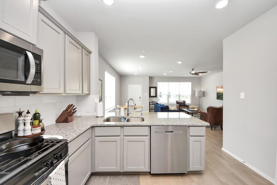 View of the kitchen looking into the dining and living room combination room. Such a great layout and flow when entertaining family and friends. Lots of great space available! View of the kitchen looking into the dining and living room combination room. Such a great layout and flow when entertaining family and friends. Lots of great space available!