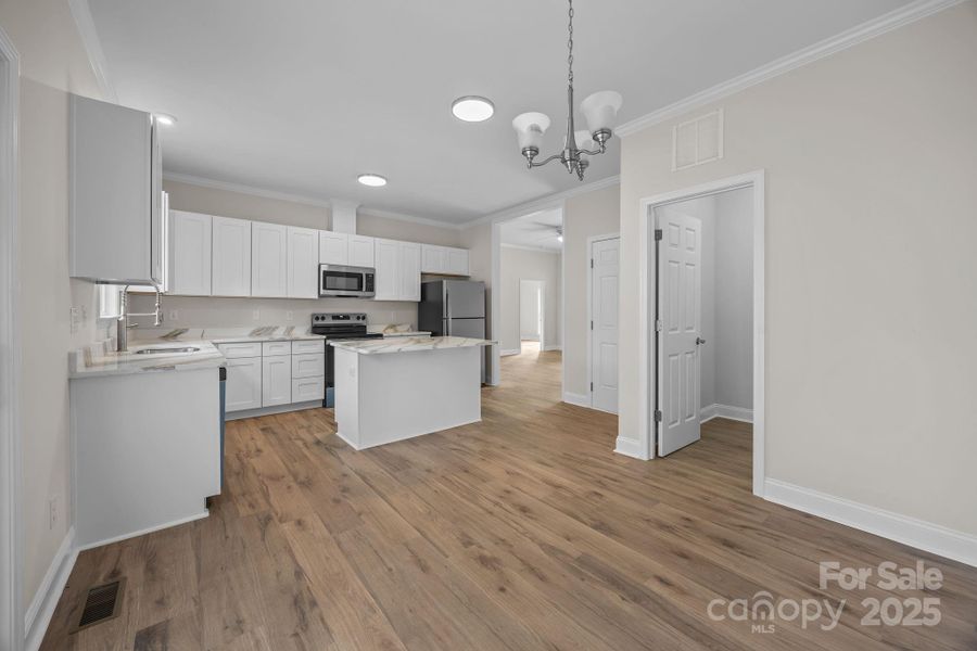 Dining and kitchen are open