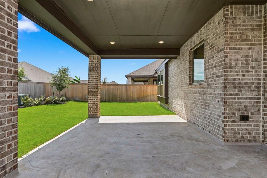 Exterior details and patio area of a home in Bridgeland, Cypress (Image 2).
