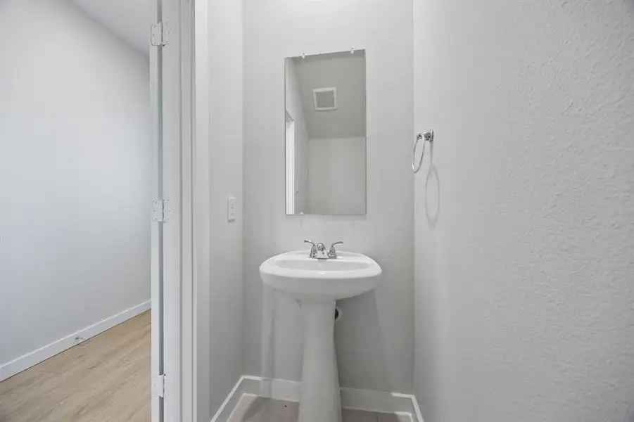 Bathroom in the Mesquite home plan by Trophy Signature Homes – REPRESENTATIVE PHOTO