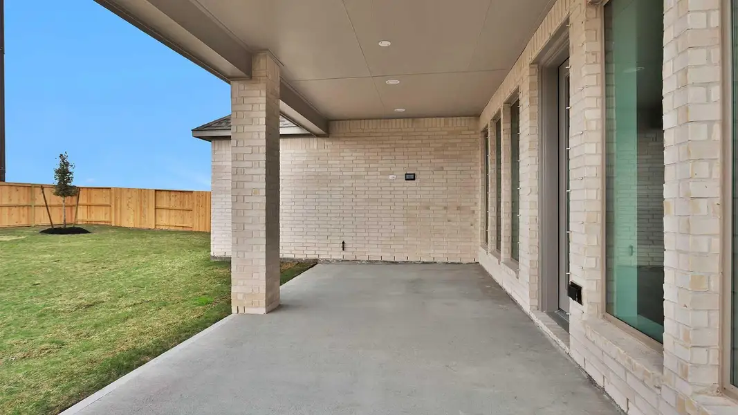 Exterior details and patio area of a home in Meridiana, Manvel (Image 4).