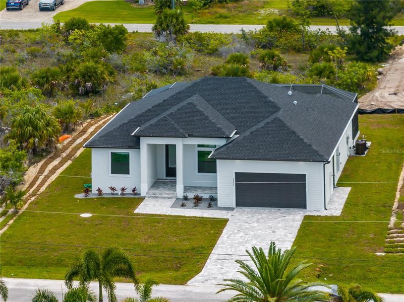 Front exterior of a new home in , Port Charlotte, FL, highlighting curb appeal (Image 27). Front exterior of a new home in , Port Charlotte, FL, highlighting curb appeal (Image 27).