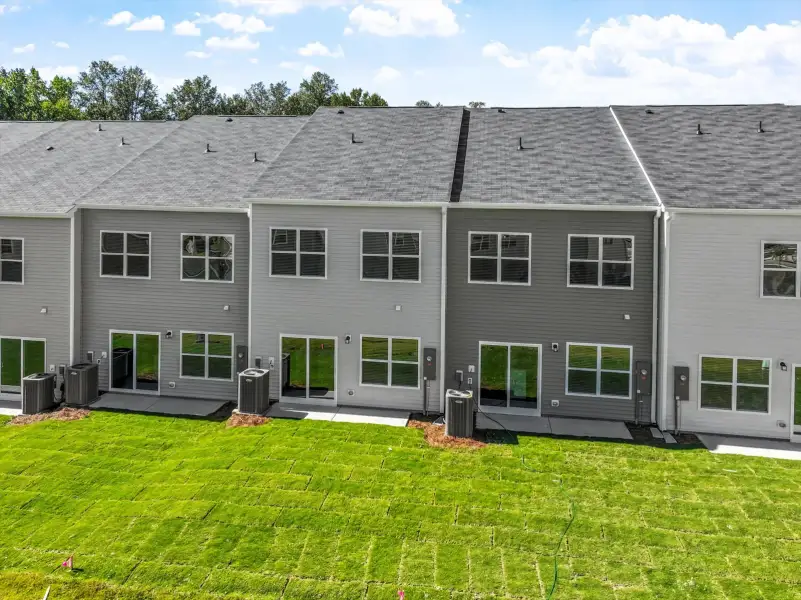 Exterior details and patio area of a home in West Main Townhomes, Sanford (Image 3). Exterior details and patio area of a home in West Main Townhomes, Sanford (Image 3).