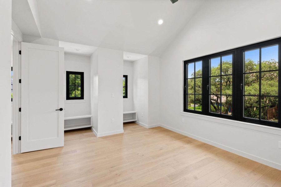 Tall ceilings and abundant natural light illuminate the inviting wood-floored interior. Tall ceilings and abundant natural light illuminate the inviting wood-floored interior.