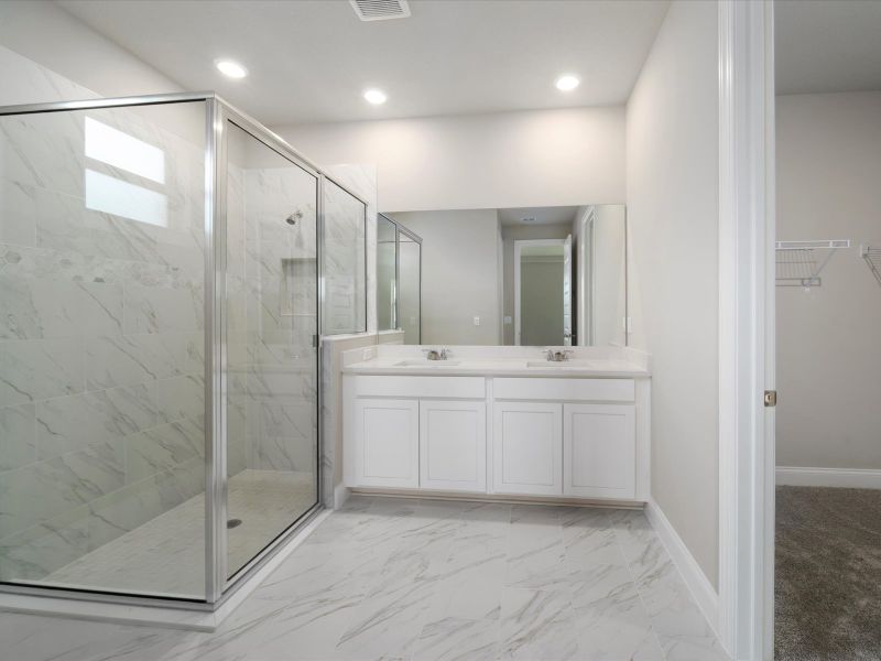 Primary Bathroom in the Coral floorplan at 6295 NW Sweetwood Drive in Brystol at Wylder