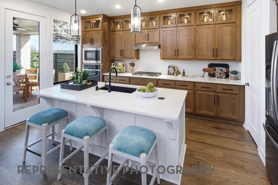 Furnished interior view inside a new home in ARTAVIA, Conroe (Image 3).