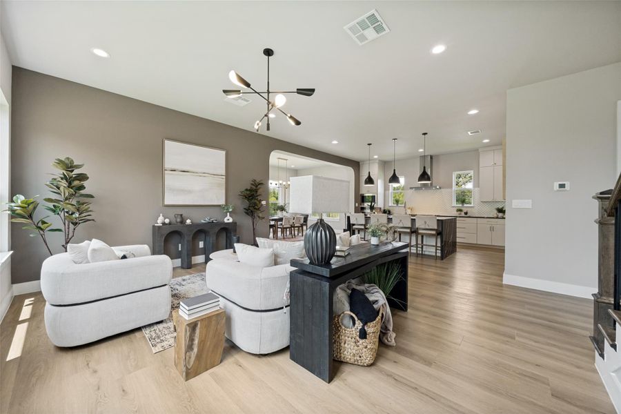An open floorplan seamlessly connects the living room and kitchen, creating an inviting atmosphere.