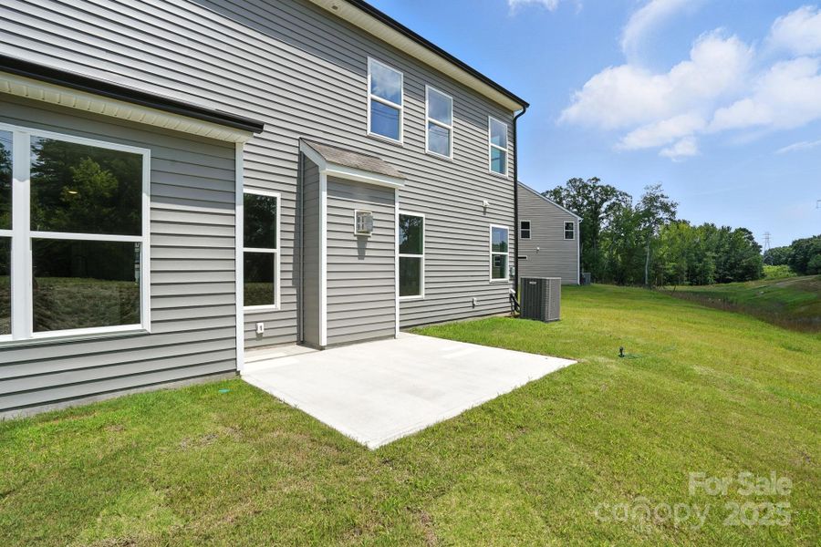 Front exterior of a new home in Hampton Woods, Charlotte, NC, highlighting curb appeal (Image 1).