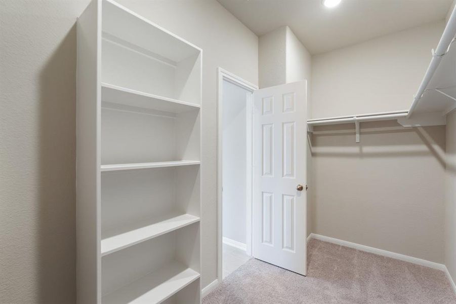 A view of your large primary walk-in Closet