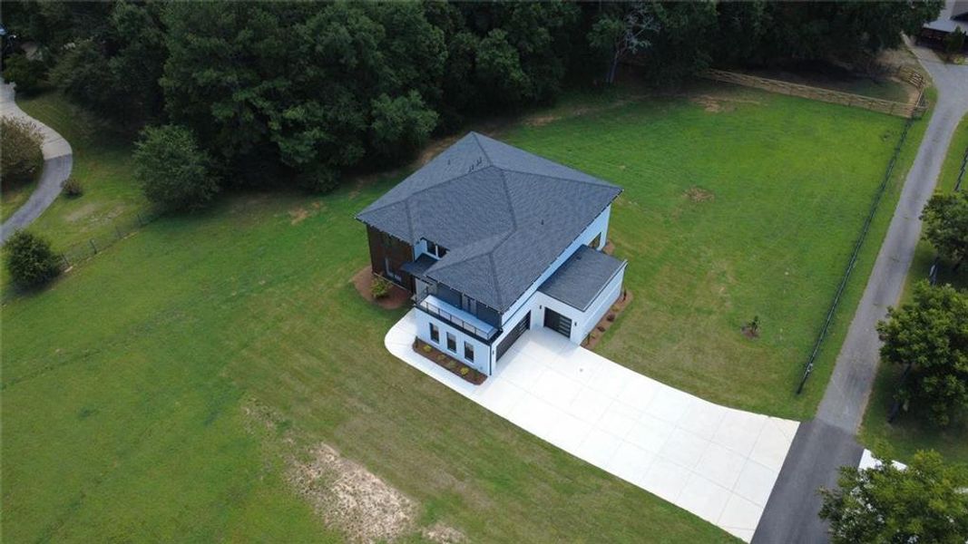 Front exterior of a new home in , Dacula, GA, highlighting curb appeal (Image 21). Front exterior of a new home in , Dacula, GA, highlighting curb appeal (Image 21).