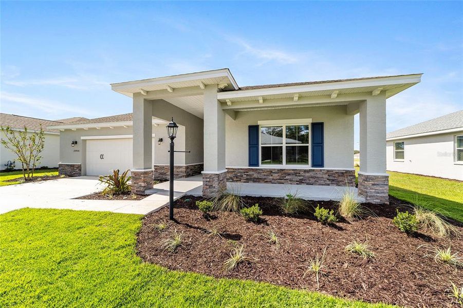Exterior details and patio area of a home in On Top of the World Communities, Ocala (Image 3).