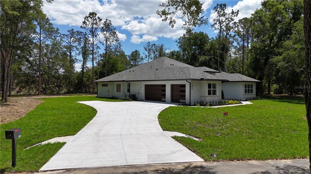 Front exterior of a new home in , Groveland, FL, highlighting curb appeal (Image 18).