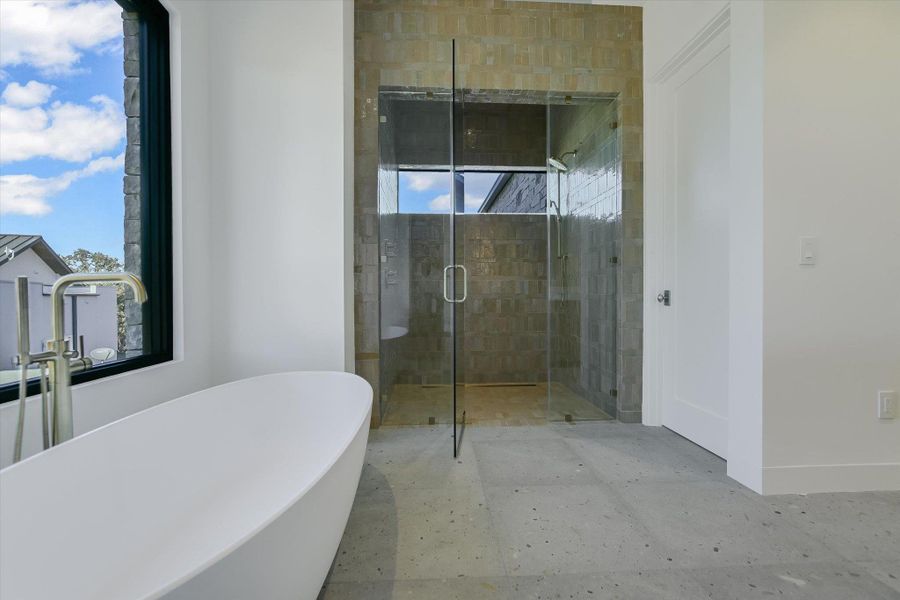 Bathroom with a soaking tub and a shower stall