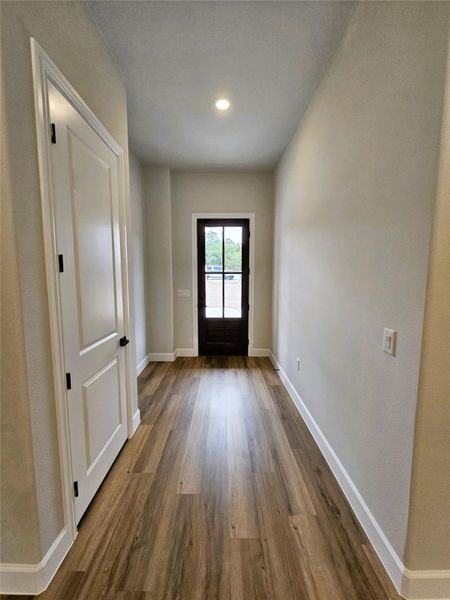 Entryway featuring wood finished floors and recessed lighting