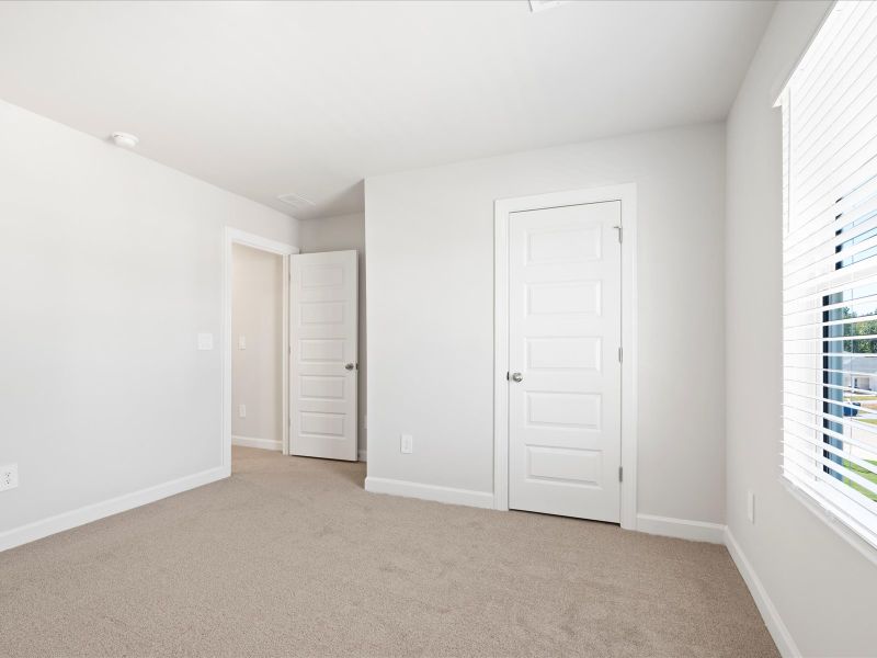 Spacious, unfurnished interior of a new home in The Farm at Wells Creek - Signature Collection, Gray Court (Image 17).