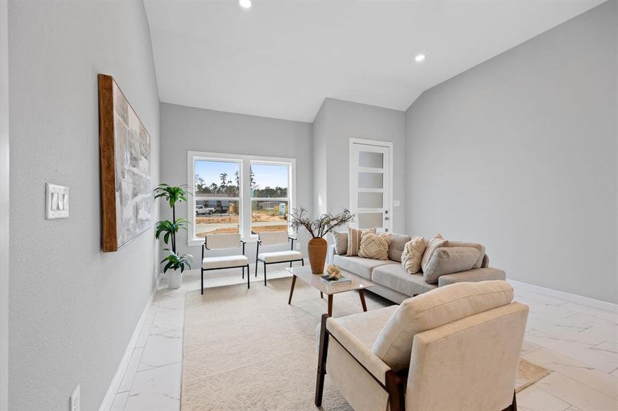 Spacious open-concept layout with high ceilings and tile flooring throughout—no carpet!