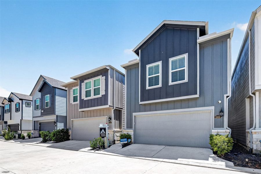 Front exterior of a new home in Park Row Village, Houston, TX, highlighting curb appeal (Image 28). Front exterior of a new home in Park Row Village, Houston, TX, highlighting curb appeal (Image 28).