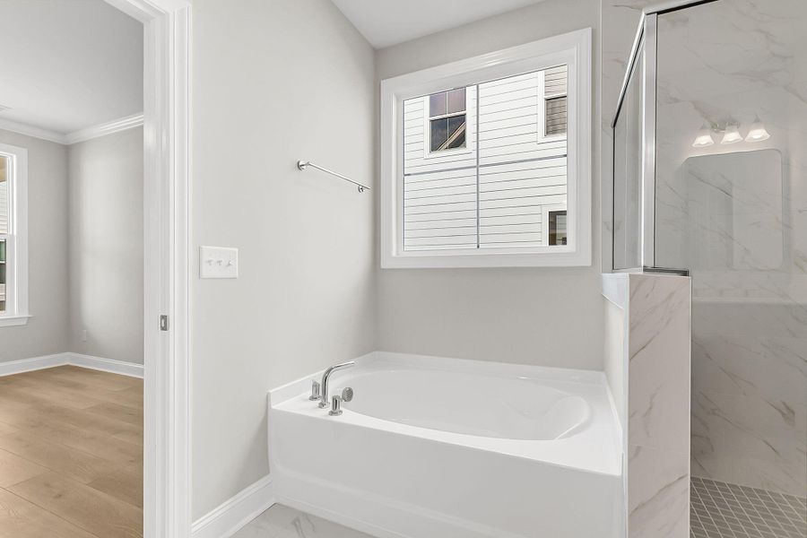 Furnished interior view inside a new home in Tidewater at Lakes of Cane Bay, Summerville (Image 12).