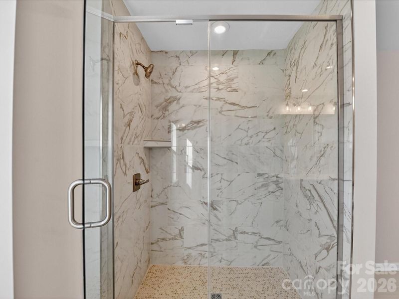 Primary Tiled Walk-In Shower. Primary Tiled Walk-In Shower.