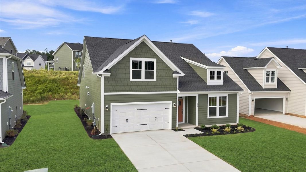 Exceptional home with tasteful exterior finishes and a thoughtfully designed façade by DRB Homes