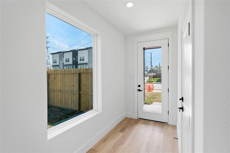 Another view from your entry way that also gives a sneak peek into your private backyard oasis a rare find in the city.