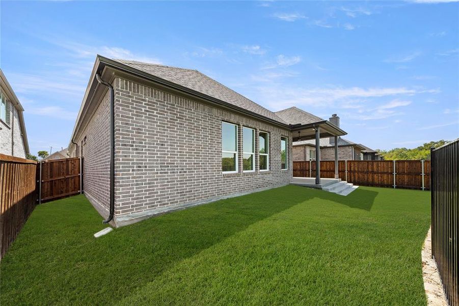Front exterior of a new home in The Highlands, Rockwall, TX, highlighting curb appeal (Image 10).