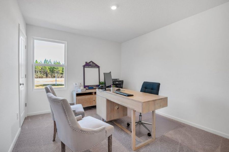 A room with a desk and chairs. A room with a desk and chairs.