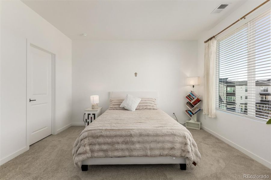 Primary bedroom with walk-in closet and bathroom