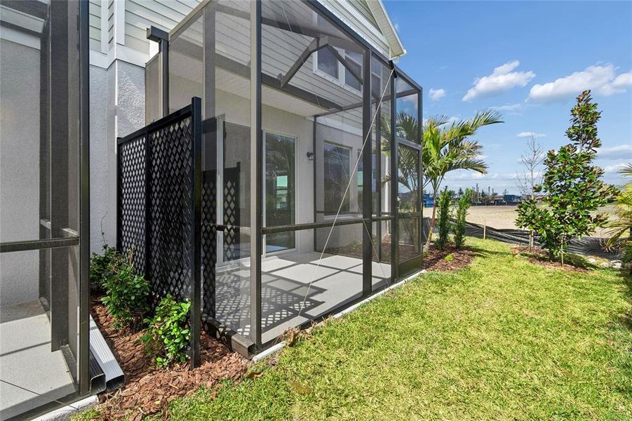 Exterior details and patio area of a home in North River Ranch – Townhomes, Parrish (Image 24).