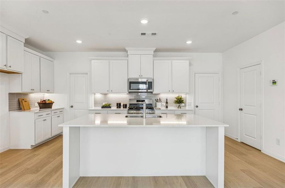 The large kitchen island makes the perfect gathering place for family and friends!