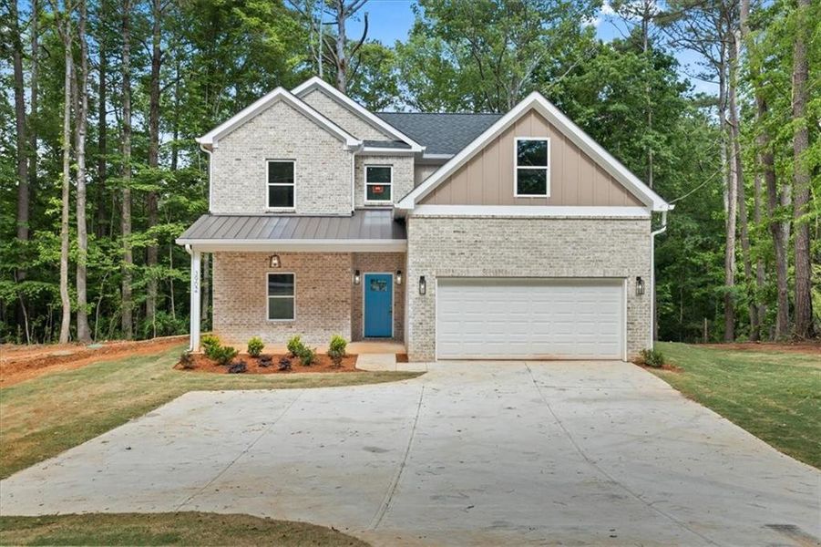 Front exterior of a new home in , Ellenwood, GA, highlighting curb appeal (Image 1).