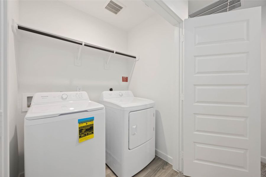 Furnished interior view inside a new home in Grand West, Houston (Image 2).