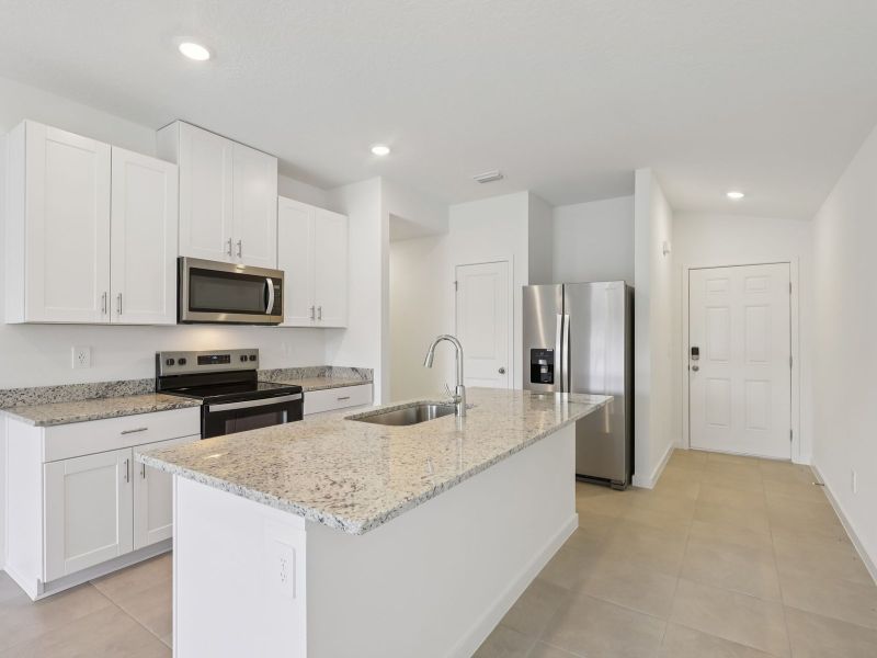 Furnished interior view inside a new home in Flagler Village - Classic Series, Palm Coast (Image 4). Furnished interior view inside a new home in Flagler Village - Classic Series, Palm Coast (Image 4).